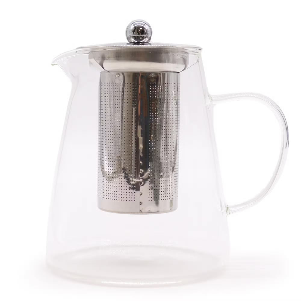 Clear glass teapot with metal infuser on a white background