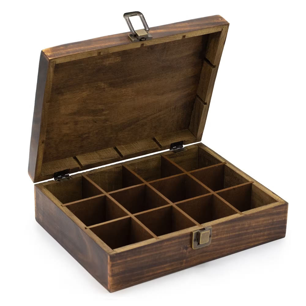 Wooden tea box with compartments on a white background