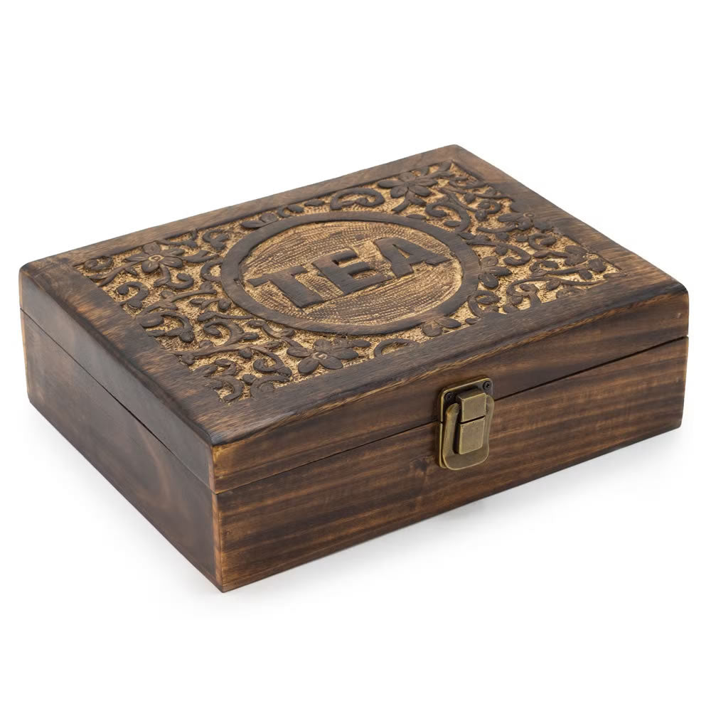 Wooden jewelry box with intricate carvings and 'TBA' logo on a white background