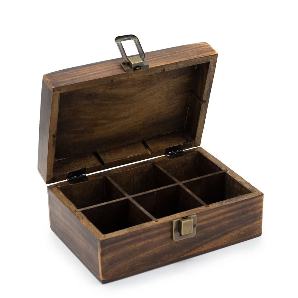 Wooden tea box with compartments on a white background