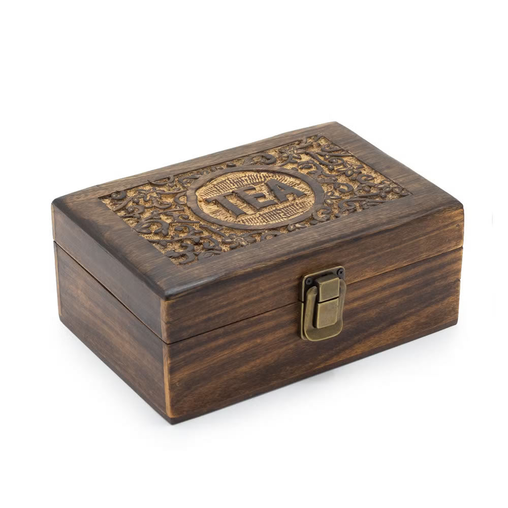 Wooden box with intricate carvings and a brass lock on a white background