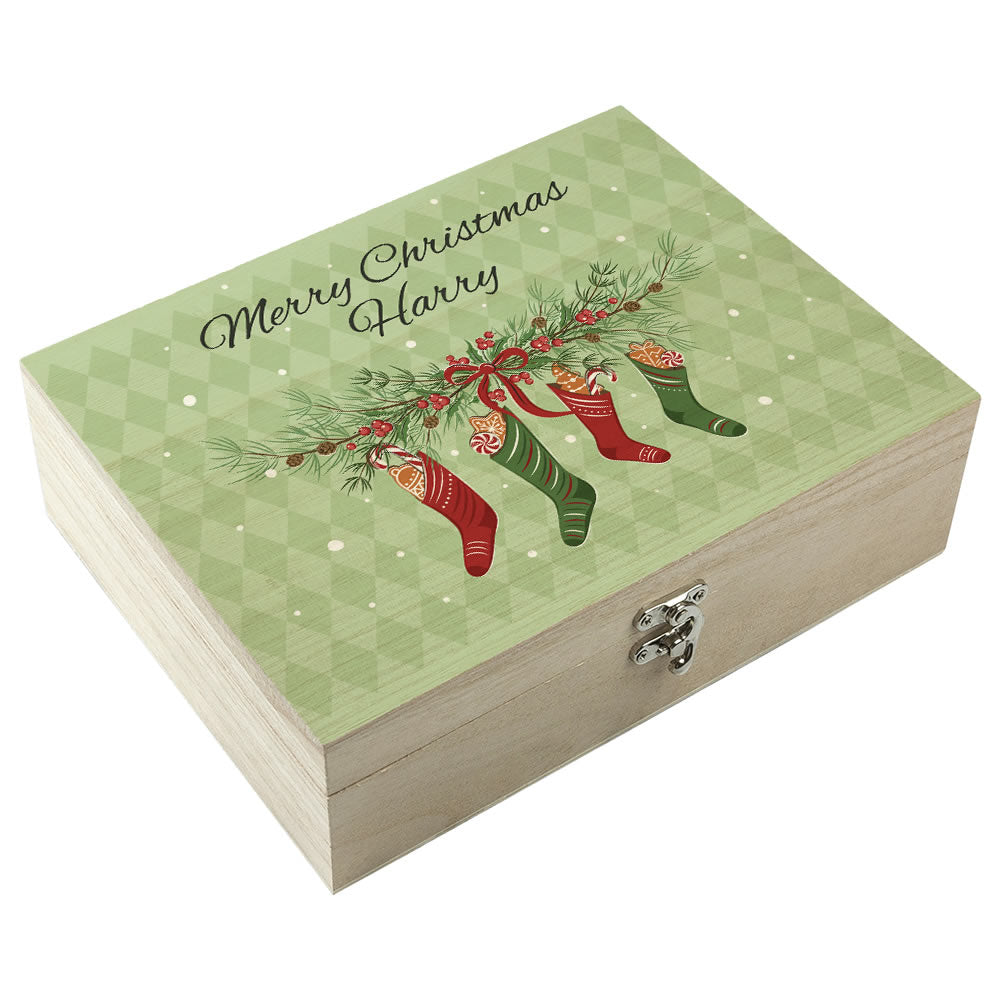 Christmas-themed wooden box with stockings and 'Merry Christmas Harry' text on a green background