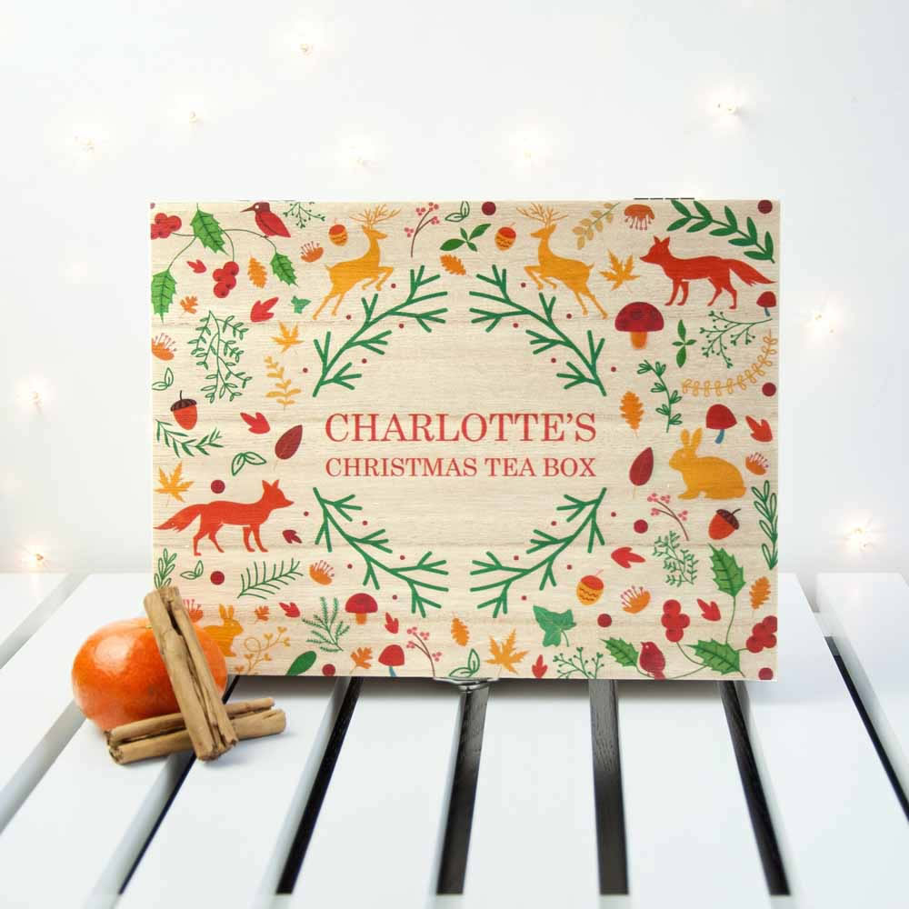 Christmas-themed tea box with festive design on a white surface