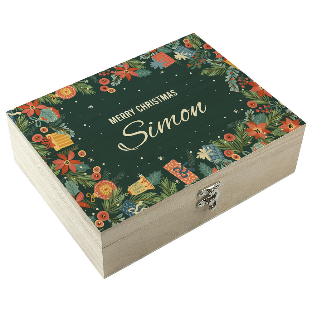 Decorative Christmas box with floral patterns and 'Merry Christmas Simon' text on a white background