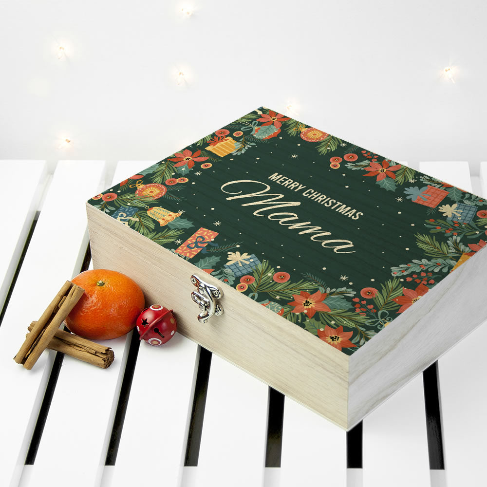 Decorative box with floral design and 'Merry Christmas Mama' text on a white surface.