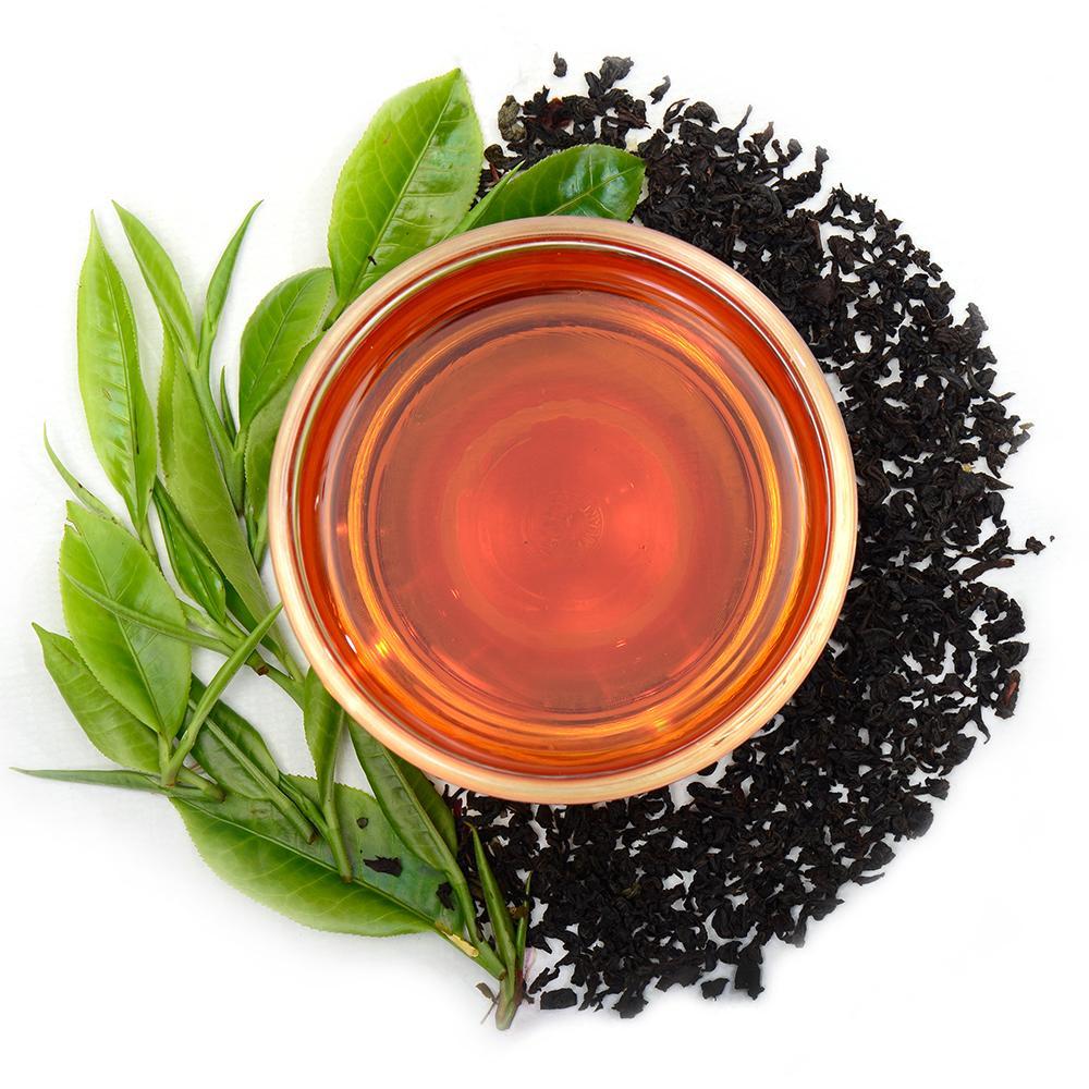 Pure Ceylon English Breakfast Black Tea (FBOP) leaves and green leaves on -  www.ceylonteabox.com 