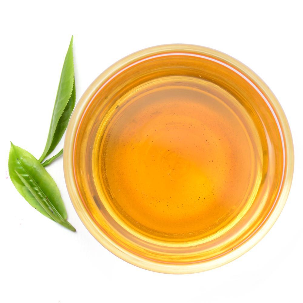 Pure Ceylon Winter Mulled Spice Tea, Tea leaves and a cup of tea on a white background - www.ceylonteabox.com