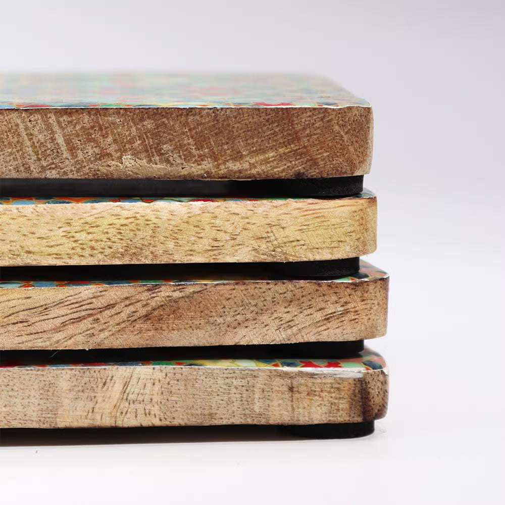 Stack of wooden boxes with colorful patterns on a white background